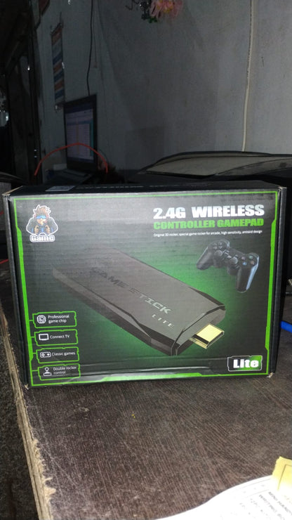 Compact retail packaging of wireless retro game console with contents displayed